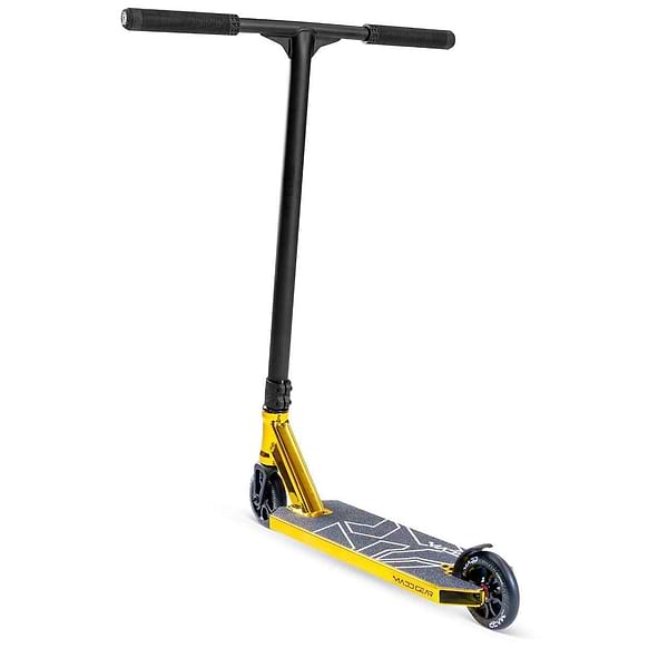 The Madd Gear MG 6 Kinetic Complete Stunt Scooter in gold and black features a lightweight aluminium deck with geometric patterns, black handlebar, ABEC-11 high-speed chrome bearings, and black wheels. Shown angled on a white background.