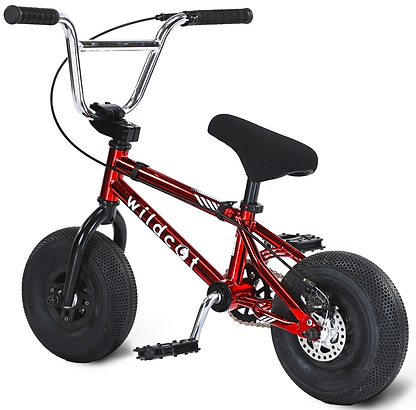 The Wildcat OG 3A Mini BMX Bike - Royal Red Bull is a compact, sturdy bike featuring thick black PRO Street 65PSI tyres, chromoly steel handlebars, pedals, a black cushioned seat, and a shiny red frame labeled "Wildcat" in white letters.