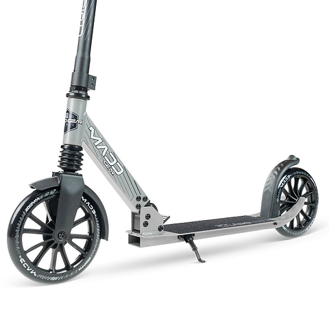 The Madd Gear Metro Cruise 250 Foldable Commuter Scooter in Black/Grey features large black wheels, front/rear fenders, a textured deck, and rear brake. Adjustable height makes it perfect for urban commuting or recreation.