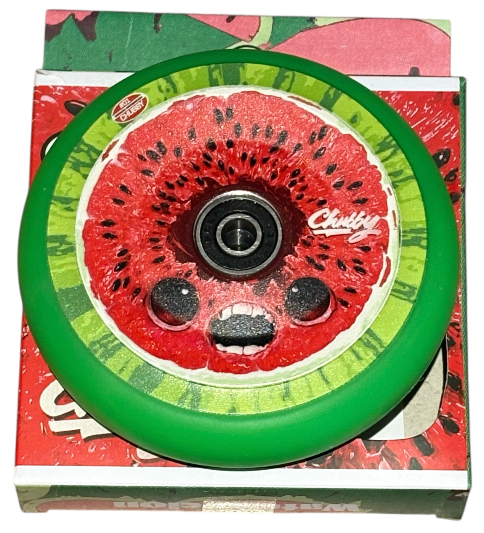The Chubby Hollowcore 110mm Stunt Scooter Wheel - Watermelon features a vibrant watermelon design with cartoon eyes and mouth on colorful packaging. The lightweight wheel displays the word "Chunky" for a playful touch. Brand: Chubby.