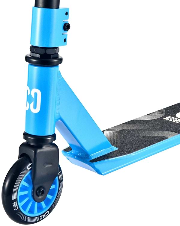 Close-up of the blue CORE CA1 Beginner Complete Stunt Scooter by CORE, featuring the front wheel, handlebar stem, and black geometric grip tape—ideal for riders seeking a stylish entry-level stunt scooter.
