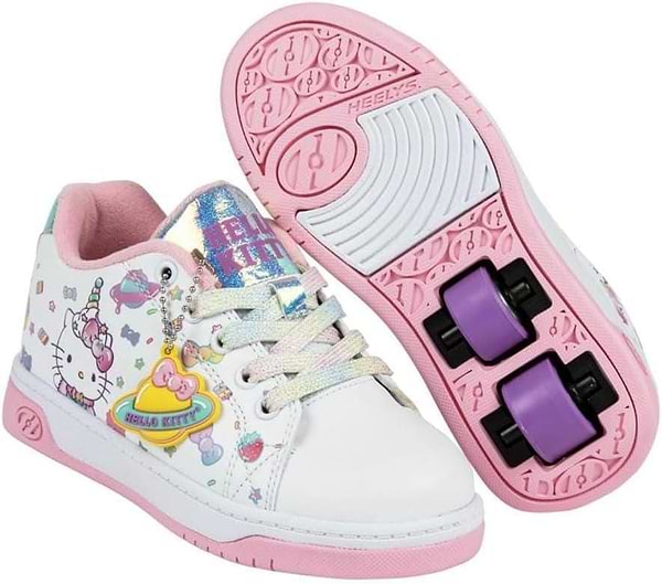 The Heelys x Hello Kitty Split X2 Girls Heelys in white and pink feature a unicorn design, rainbow details, ABEC 3 bearings, and removable purple wheels. One shoe shows the top view; the other displays the sole with wheels attached.