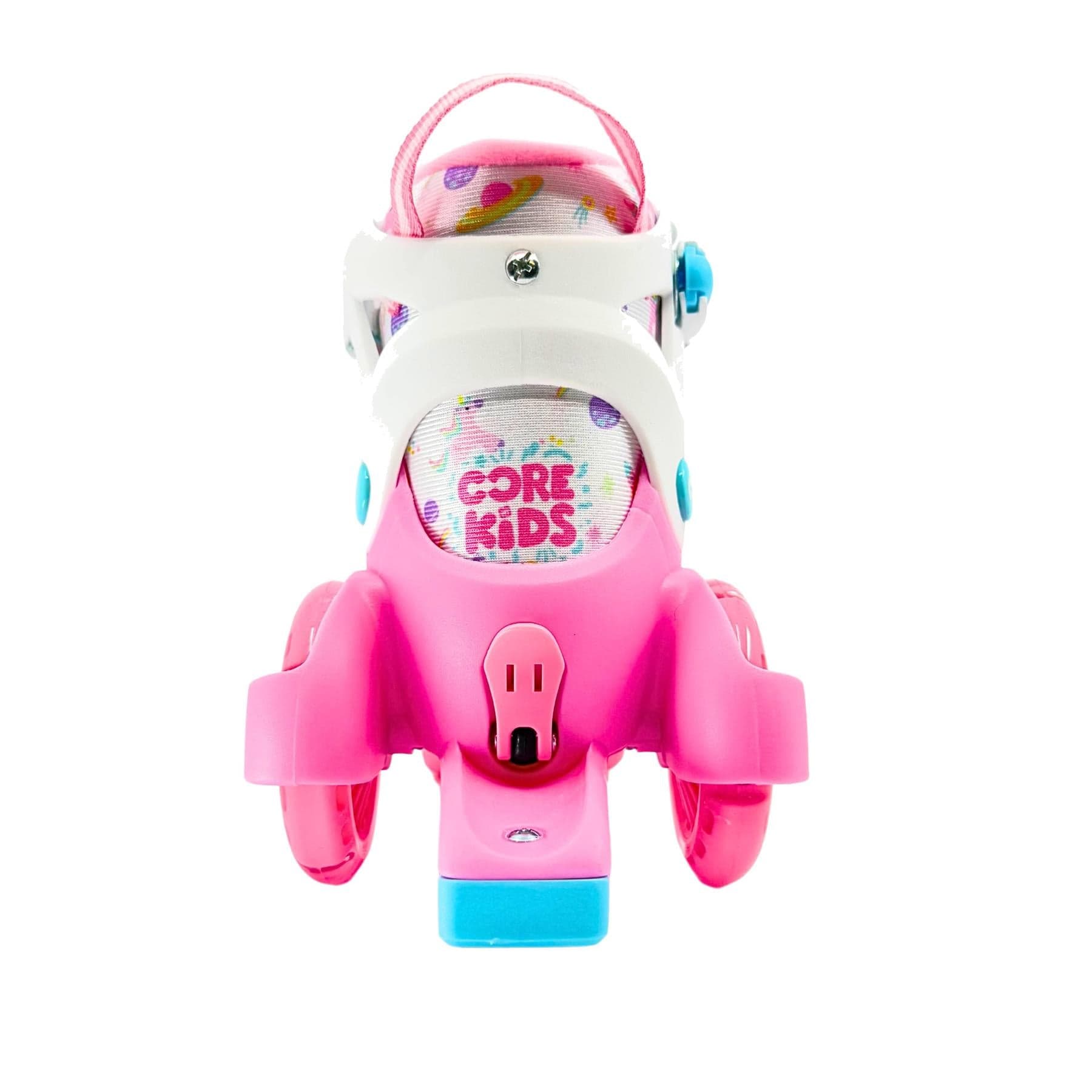 A front view of the CORE Kids Newbie LED Adjustable Roller Skates in pink and blue, featuring four wheels, playful design, "Core Kids" inner lining, and adjustable sizing—perfect for first-time skaters.