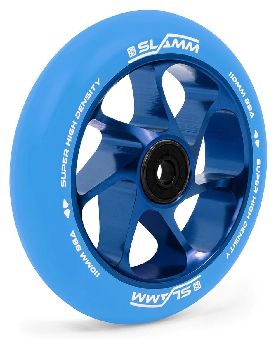 A close-up of the Slamm Team 110mm Stunt Scooter Wheel in blue, featuring metallic blue spokes, a black bearing, high-rebound PU tire, and “SLAMM,” “SUPER HIGH DENSITY,” and “110MM 88A” in white on the rim.