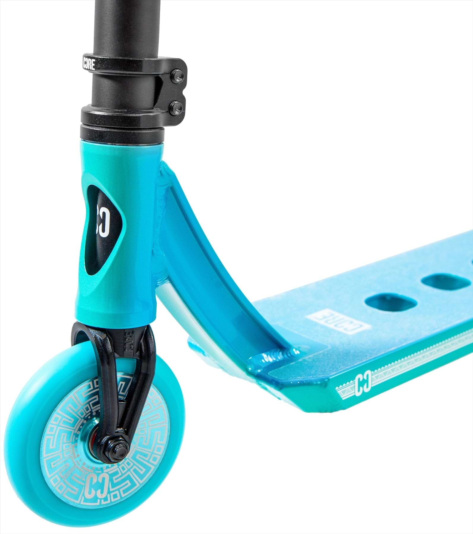 Close-up of the CORE CL1 Complete Stunt Scooter - Turtlesent by CORE, highlighting the blue and teal front section with wheel, fork, deck cut-out holes, and white graphics.