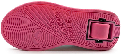 The Breezy Rollers Blast Shoes - Pink feature a textured pink sole with raised grooves and a visible retractable heel wheel, showcasing Breezy Rollers’ patented wheel system for smooth rolling.