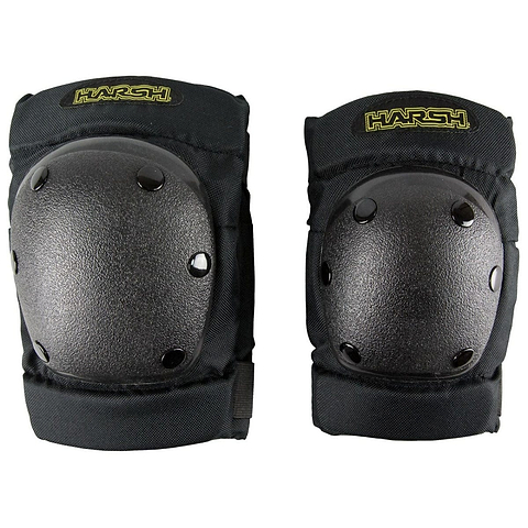 The Harsh Attitude Knee / Elbow Combo Skate Protection Pad Set in black, from our Youth Protective Equipment line, includes hard protective shells and adjustable straps. Ideal for safety during action sports such as skating or biking, these pads prominently showcase the Harsh brand name in yellow text on each piece.