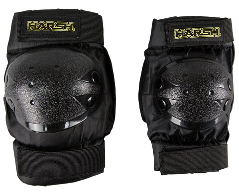 The Harsh Kids Knee / Elbow Combo Skate Protection Pad Set in black features two knee pads with hard plastic caps and adjustable Velcro straps, making it perfect for action sports. The brand name "Harsh" is prominently displayed in yellow text on the elastic bands. This protective gear set, designed for kids, is shown side by side against a white background.