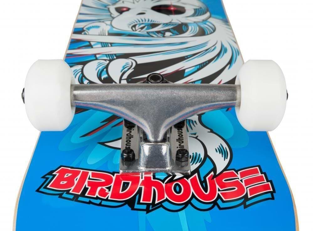 Close-up view of the Birdhouse Stage 1 Hawk Spiral Blue Complete Skateboard, featuring a metal truck and white wheels. The deck displays a vibrant graphic of a bird-like creature on a blue background, with "BIRDHOUSE" prominently written in red letters, making it ideal for both beginners and experienced riders.