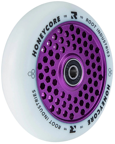 The Root Industries Honeycore 110mm Stunt Scooter Wheel in White/Purple features a striking purple honeycomb-patterned metal core and bold “HONEYCORE ROOT INDUSTRIES 110” black lettering around the rim. Designed by Root Industries, this wheel delivers both standout style and high performance for dedicated stunt scooter riders.
