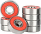 A close-up of several Ventro Ceramic ABEC 11 Red Bearings, a set of 8 skateboard bearings by Ventro, some stacked and some lying flat on a plain white background.