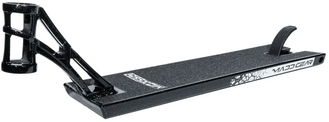 The Madd Gear MGP MGX Black Stunt Scooter Deck (5.5″ x 20.5″) features a sleek black and silver design, a textured grip surface, and a cutout headtube with bold “Madd Gear” branding—ideal for riders looking for a versatile park and street scooter deck from MGP.