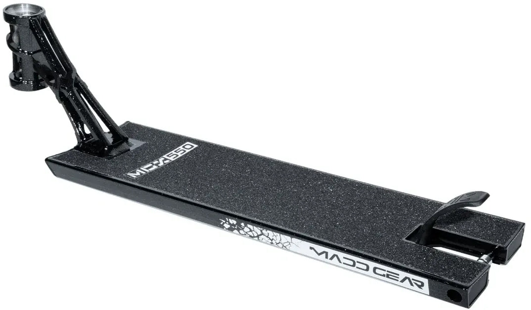 The Madd Gear MGP MGX Black Stunt Scooter Deck (5.5″ x 20.5″) features a textured surface, angled rear brake, and a white logo on the side. Designed for both park and street riders, this deck from Madd Gear is ideal for performing tricks and stunts.