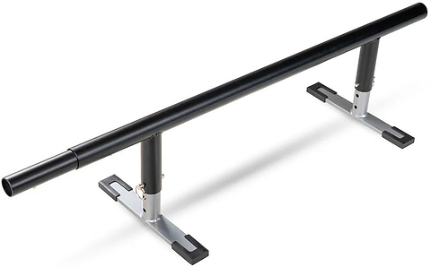A black metal Madd Gear skate rail with adjustable height and sturdy silver-and-black base legs for skate or inline tricks. Compatible with the Madd Gear MGP Grind Rail Extension Kit - 91cm for added length and challenge.