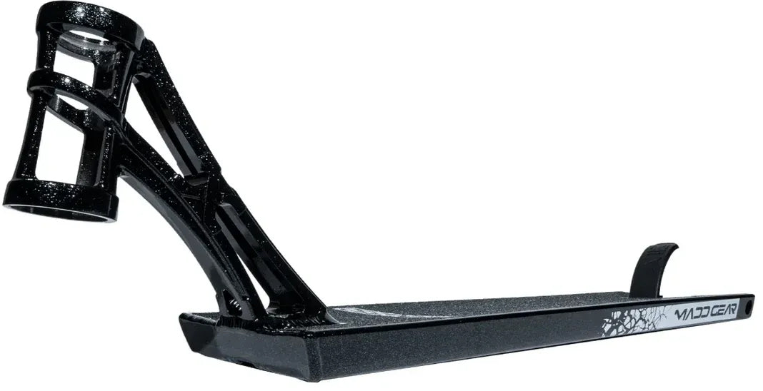 A Madd Gear MGP MGX Black Stunt Scooter Deck, measuring 5.5″ x 20.5″, featuring a textured surface, upward angled neck, and a foot brake at the rear. Designed for park and street riders, it includes white graphic details near the end.