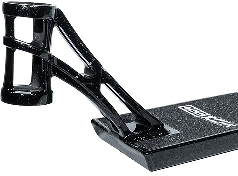 Close-up of the Madd Gear MGP MGX Black Stunt Scooter Deck (5.5″ x 20.5″) featuring a black finish with white specks, headtube, and two support arms attached to the base. The deck includes griptape with a partially visible Madd Gear logo—perfect for both park and street scooter riding.