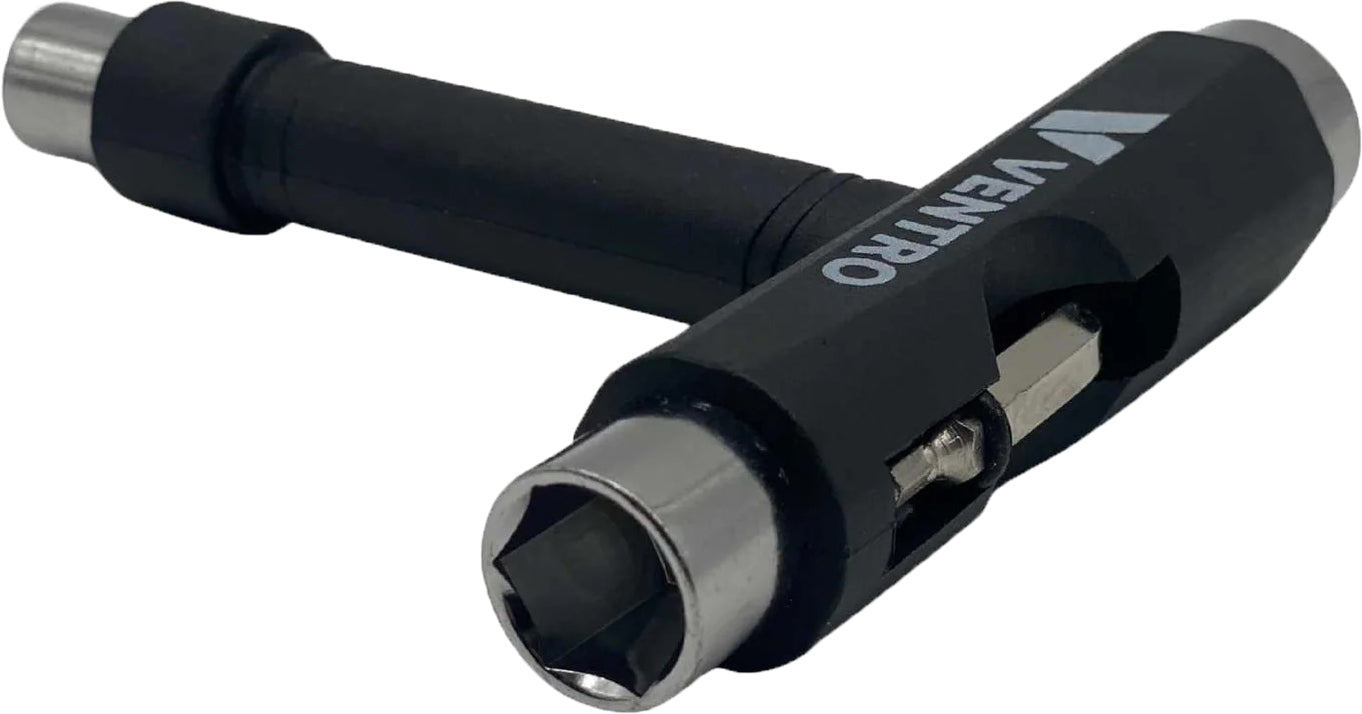 The Ventro Roller Skates / Skateboard Multi T-Tool - Black by Ventro is a black and silver T-shaped tool labeled "Ventro," featuring multiple wrench sizes and a built-in screwdriver in the handle—ideal for use as both a skateboard and roller skate tool.