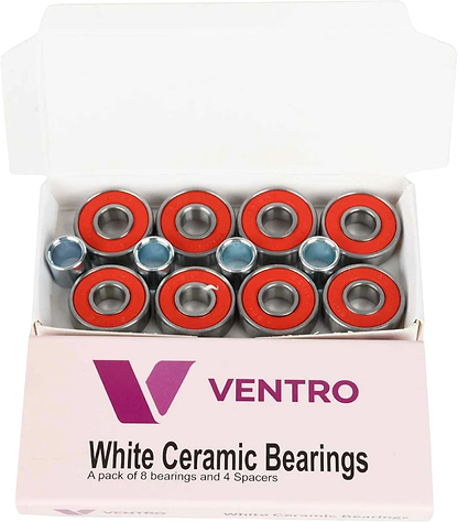 An open box labeled "Ventro Ceramic ABEC 11 Red Bearings - Set of 8" from Ventro contains eight red-sealed ceramic skateboard bearings and four silver spacers, all neatly arranged inside the packaging. These precision-engineered ABEC 11 bearings come in the popular 608 size, ensuring a smooth and reliable ride for any skateboard setup.