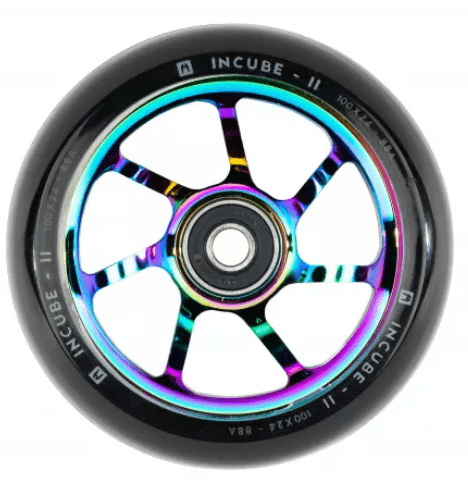 The Ethic DTC Incube V2 100mm Stunt Scooter Wheel in Neochrome boasts rainbow-colored metal spokes paired with a black rubber tire. The outer rim is labeled with "Incube V2" and "100x24 - 88A." Its design, crafted by Ethic DTC, showcases a central hub and six evenly spaced spokes.