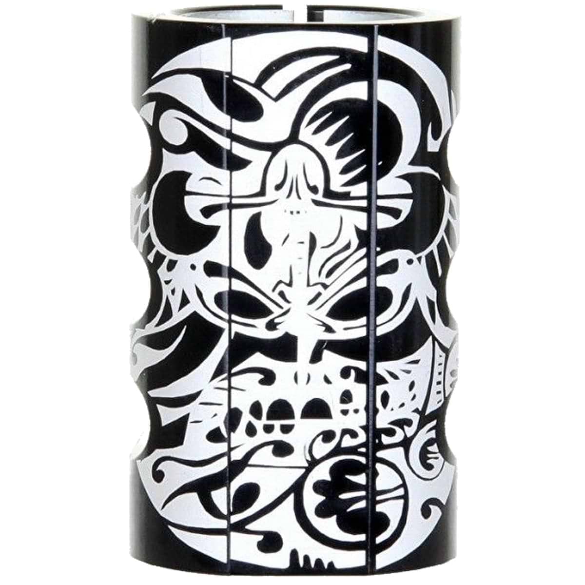 A black cylindrical object adorned with abstract, symmetrical designs that feature swirling patterns and shapes, resembling the Infinity Mayan 4 Bolt Oversized SCS Stunt Scooter Clamp by Infinity.