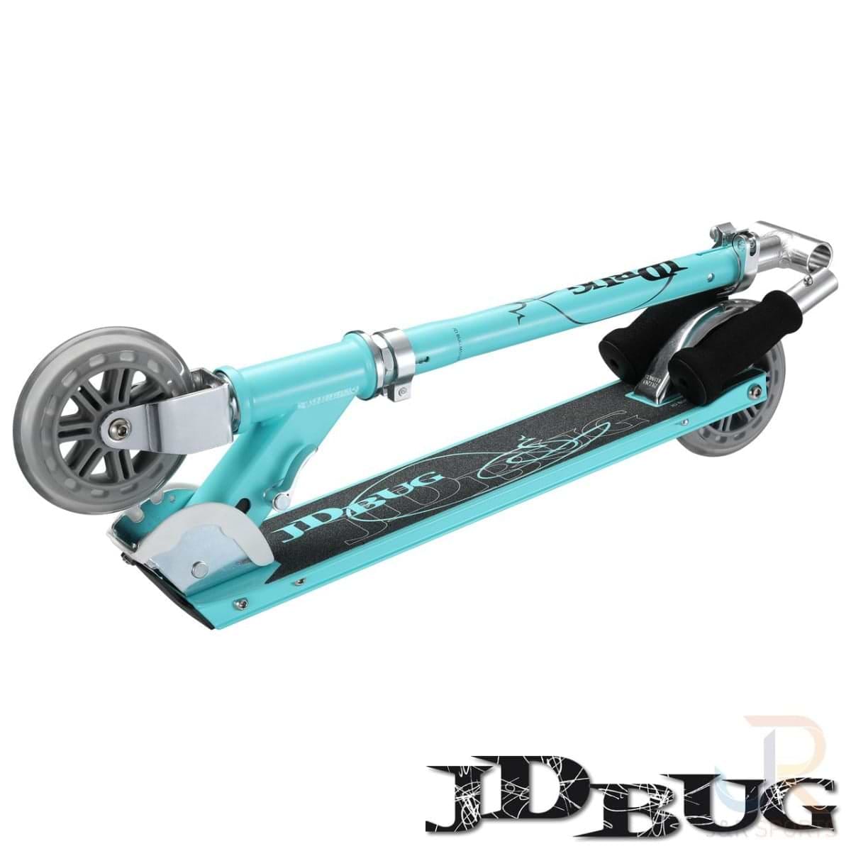 The JD Bug Classic Street 120 Kids Foldable Kick Scooter in matte teal features a lightweight design with translucent wheels, black grip tape, and a visible kickstand. It includes adjustable handlebars with black foam grips and prominently displays the "JD Bug" logo.