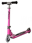 The JD Bug Original Street MS130B scooter in pastel pink features black foam handles and silver metal parts, a visible logo on the stem and deck, clear wheels, and is foldable—perfect for kids. It stands upright against a plain white background.