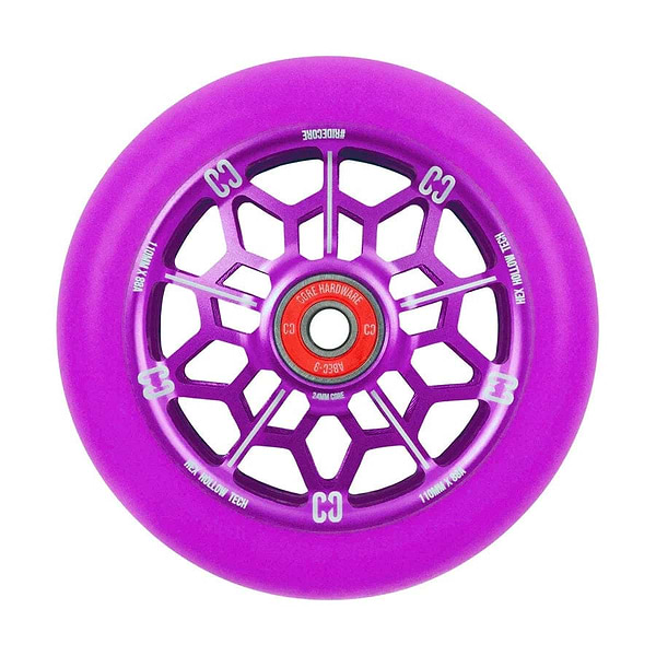 The CORE Hex Hollow Core 110mm Stunt Scooter Wheel - Purple showcases a captivating purple geometric spoke design and a bold red core. It is equipped with ABEC 9 Bearings and an 88a compound for exceptional performance. The wheel features white text encircling the edge, highlighting the CORE brand and specifications, blending style with quality.