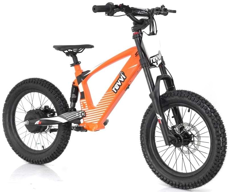 The Revvi 18" Kids Electric Balance Bike in vibrant orange boasts rugged black tires and a striking frame design, with the brand name "Revvi" prominently displayed on the front. Equipped with a sturdy suspension fork and hydraulic disc brakes, it's ideal for exciting off-road adventures.