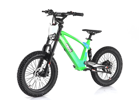 The Revvi 18" Kids Electric Balance Bike in green features thick black tires and a robust frame. Designed with young adventurers in mind, it boasts hydraulic disc brakes, a front suspension fork, and a comfortable seat, while the Revvi brand name is prominently displayed on the frame.
