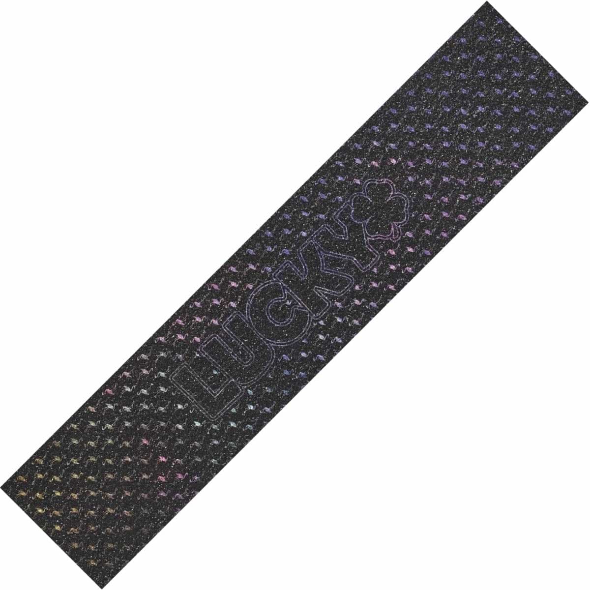 Introducing the Lucky Grippertape Stunt Scooter Griptape - Flamingo: This griptape features a wear-resistant black base adorned with a pattern of small colorful stars. At the center, it showcases the embossed word "LUCKY" along with a four-leaf clover design, all backed by durable 3M adhesive for secure application.