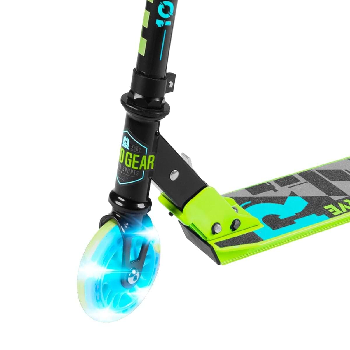 A close-up of the Madd Gear Carve Rize Foldable Light Up Kick Scooter - Waves reveals its glowing front wheel. The black and green scooter with an adjustable handlebar features a graphic deck and "Madd Gear (MGP)" on the frame, while the transparent wheel emits a captivating blue light.