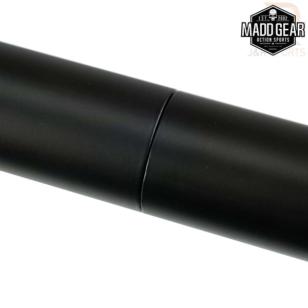 Close-up of the Madd Gear MGP Fifty5 Grind Rail - 140cm, a black cylindrical metal tube with a smooth surface perfect for grind tricks, highlighted by a subtle midsection seam. The top-right corner showcases the "Madd Gear (MGP)" logo. This Madd Gear Grind Rail is set against a pristine white background.