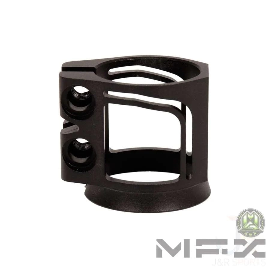 A sleek black metal scooter clamp crafted from durable T6 aluminium alloy, featuring multiple cut-outs and two vertical screw holes on the left side for easy attachment. The Madd Gear MGP MFX X2 logo and "J&R Sports" are prominently displayed in the bottom right corner.