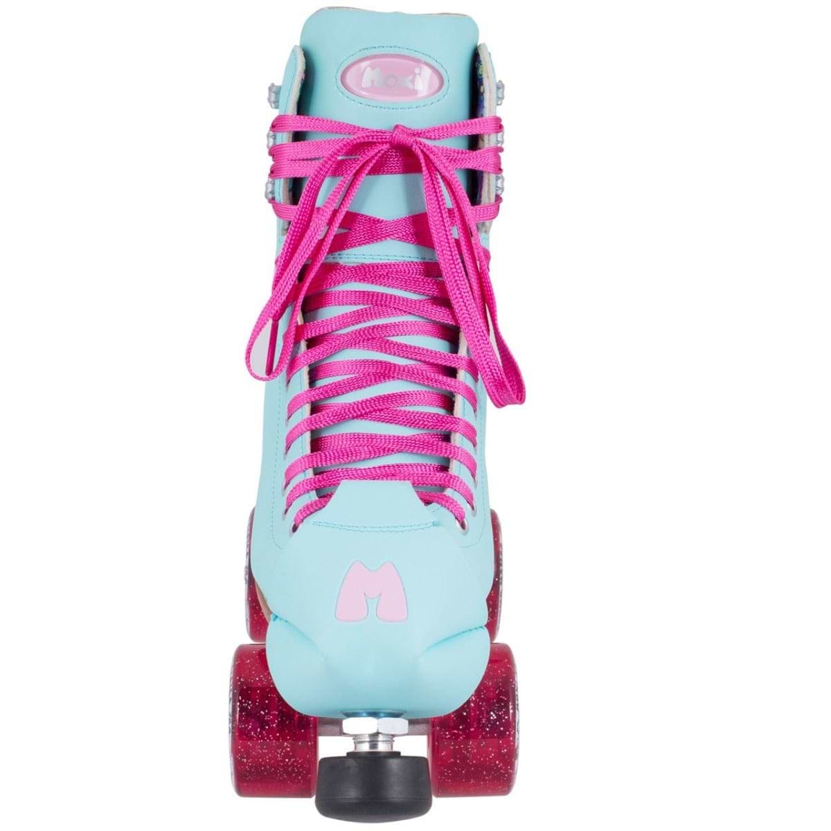 A Sky Blue Moxi Beach Bunny quad roller skate, featuring vibrant pink laces and glittery wheels, ideal for animal-friendly skating adventures. Positioned to face the viewer, it prominently showcases an "M" logo above the toe stop, adding a touch of sparkle that is characteristic of Moxi's signature style.