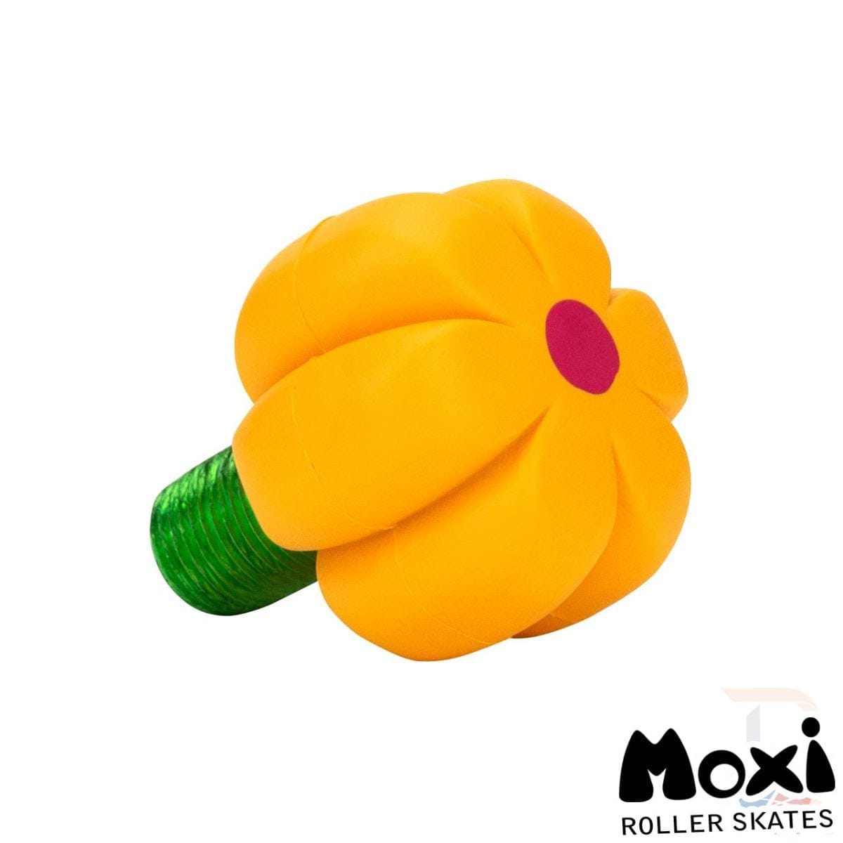 Introducing the Moxi Brake Petal Roller Skate Toe Stops - Yellow Daisy: a striking yellow daisy-shaped design showcasing a durable center and rubber stem. Featuring the Moxi logo in the bottom right corner, these toe stops combine style and durability for your skating adventures.