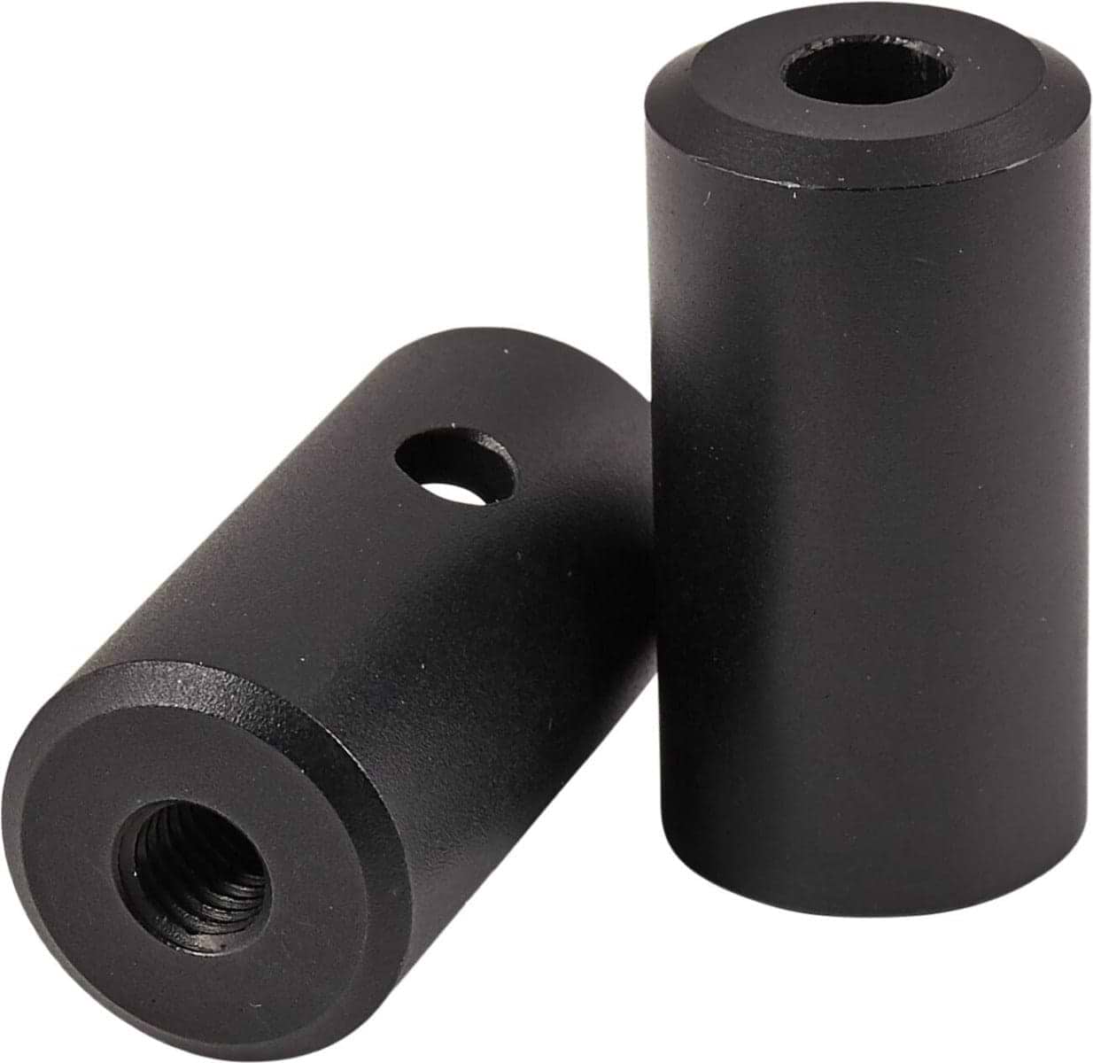 Two black cylindrical spacers, reminiscent of Native Advent Stunt Scooter Deck Ends - 140mm by Native, one lying down and one standing upright. Each aluminum spacer features a central threaded hole and a side hole. The objects are placed on a pristine white background.