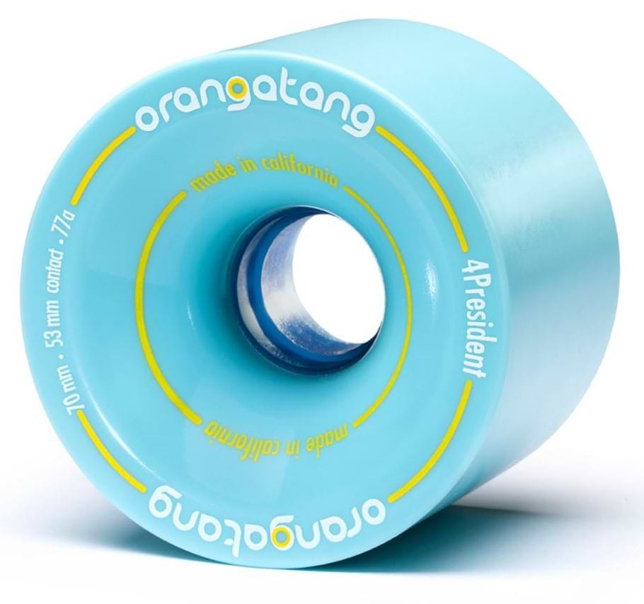 A blue Orangatang 4President 70mm 77A longboard wheel features "Orangatang," "made in California," and "4President" in yellow and white text. The wheel’s durometer, along with other dimensions and specifications, is displayed in smaller text.
