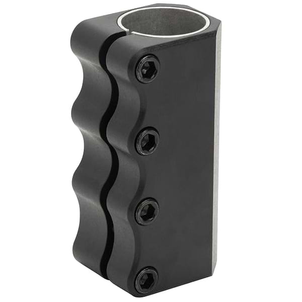 The Proto Full Knuckle V2 4 Bolt Oversized SCS Stunt Scooter Clamp - Black, by Proto, features a black metallic compression clamp design with four screws on one side. Its wavy exterior and open circular top make it perfect for securing cylindrical objects such as the handlebars of an SCS scooter.