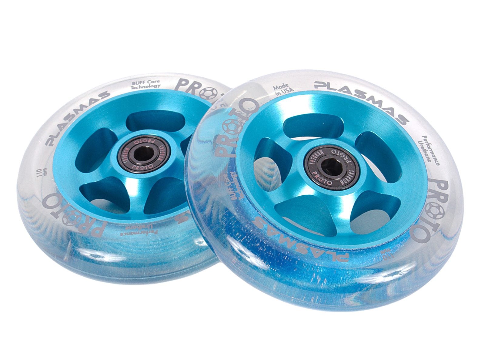 The Proto Plasma 110mm Stunt Scooter Wheels in Clear/Electric Blue boast transparent outer layers that reveal their metal cores, highlighting the sleek design. Featuring "PLASMAS" and "PROTO" written in white on a plain background, these wheels are equipped with advanced BUFF Core Technology for enhanced performance.