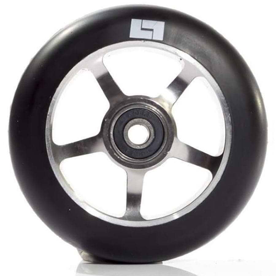 A close-up of the Logic 5 Spoke 100mm Stunt Scooter Wheel - Titanium showcases its black tire with a silver hub crafted from 6061-T6 Aluminium, featuring ABEC 9 bearings. A small stylized "L" logo adorns the side of the tire, all set against a white background.