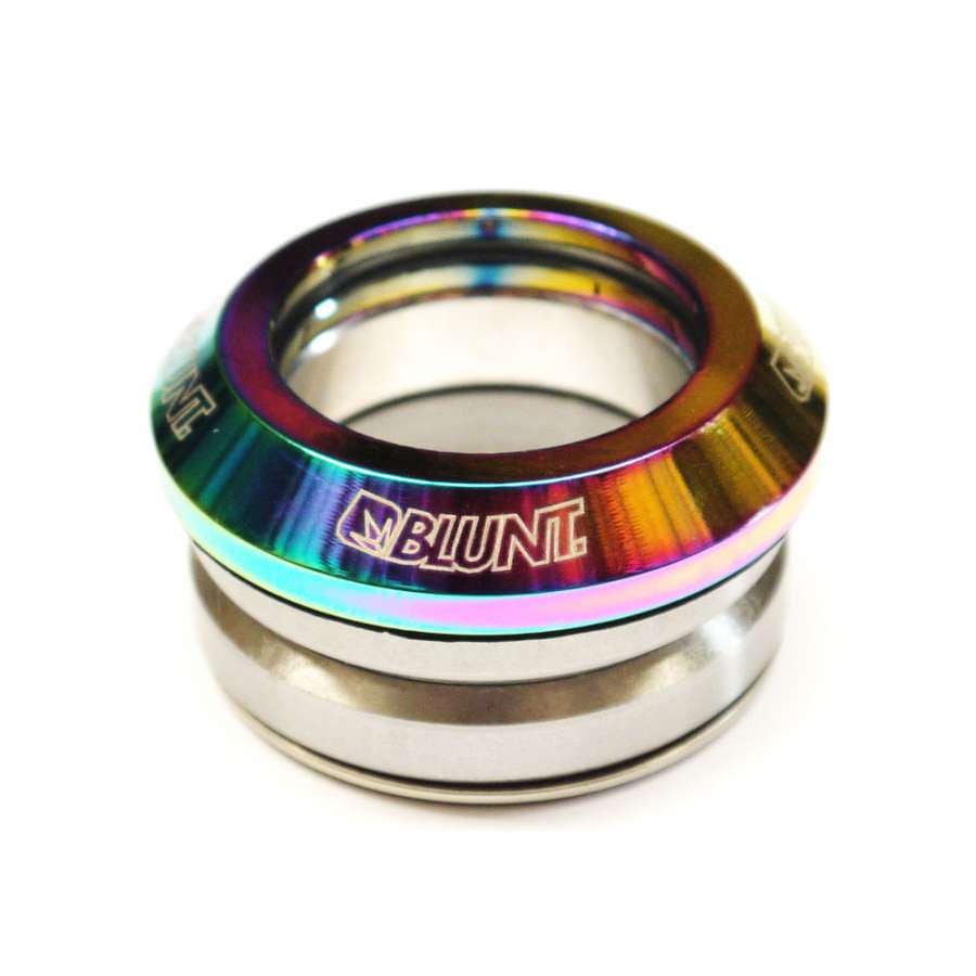 The Blunt Envy Integrated Stunt Scooter Headset showcases a striking close-up of its vibrant, metallic component. Featuring the "Blunt Envy" logo, the headset boasts an oil slick neochrome finish on the top and a silver base, expertly designed for seamless integration with scooter decks. Perfect for upgrading your stunt scooter setup.