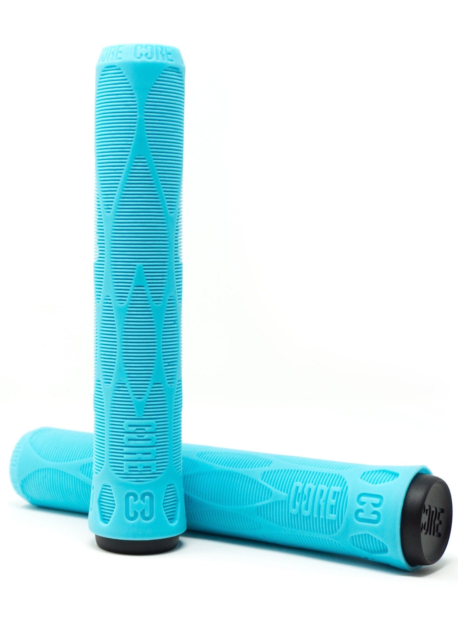 Featuring a dynamic teal color, the CORE Pro scooter grips are crafted from a shock-absorbing material with textured patterns. The word "CORE" is prominently displayed on each grip, with one lying down and the other standing upright against it to highlight their tapered ends for optimal performance.