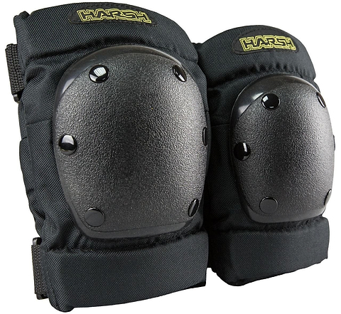 The "Harsh Attitude Knee / Elbow Combo Skate Protection Pad Set - Black" features knee pads with hard shell caps and adjustable straps, highlighted by the "Harsh" logo in yellow. This action sports gear is ideal protective equipment for youth engaging in activities like skateboarding or biking.