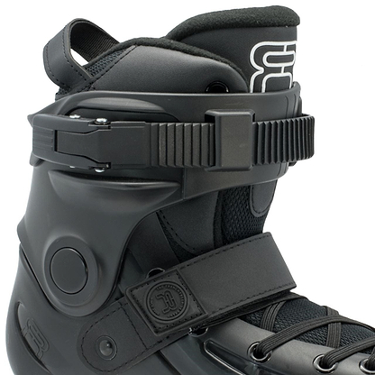 Close-up of the FR Skates Junior Adjustable Inline Skate boot in black, showcasing adjustable straps and a padded interior. The design incorporates a buckle, laces, and an embossed logo on the side, paired with durable polyurethane wheels for smooth rides.