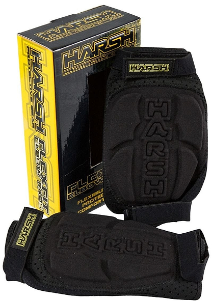 Beside a yellow and black box labeled "Harsh Pro FlexFit Elbow Gasket Skate Protection Pad - Black," there sits a pair of elbow pads branded by Harsh. Designed for comfort and protection, these pads feature multi-point padding and adjustable straps.