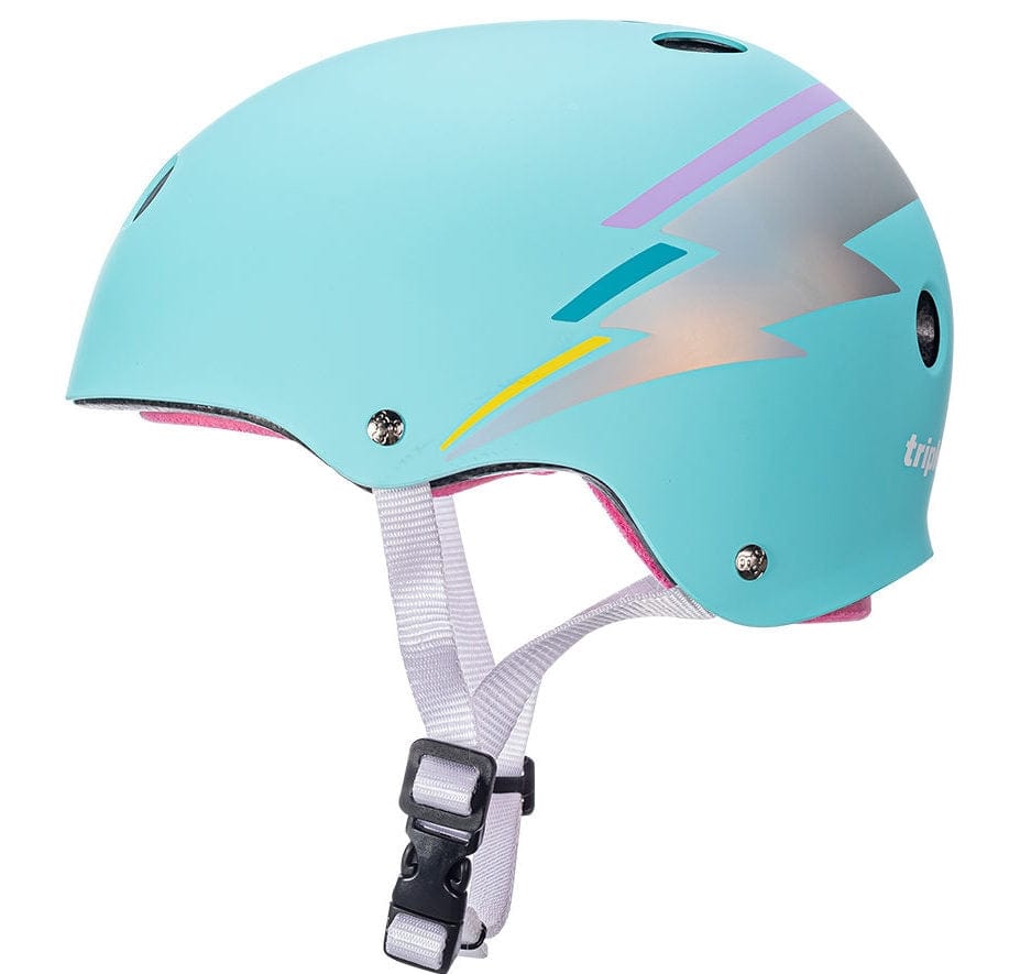 A teal hologram Sweatsaver Helmet with a pink interior, featuring a silver and purple lightning bolt design on the side. The Triple 8 Certified Skate Helmet provides dual-certified protection, includes ventilation holes, and has an adjustable chin strap with a black buckle.