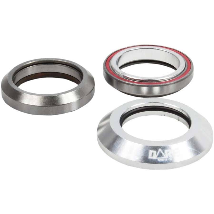 The Dare Fighter Integrated Stunt Scooter Headset from Dare is set up in a triangular shape with three metallic bearings. The top two are different colors, one showcasing a red seal, while the bottom bearing is a shiny silver that has "DAB" inscribed on it.