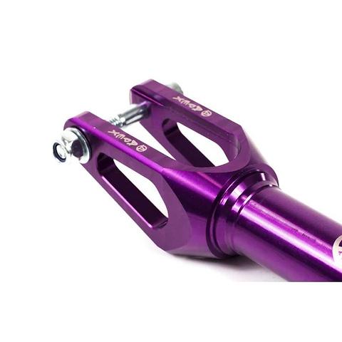 Close-up of the Apex Quantum SCS/HIC Stunt Scooter Forks in purple by Apex, featuring a sleek and angular design with bolt fittings. This durable fork upgrade is crafted for performance, showcasing precision craftsmanship with a smooth, metallic finish.