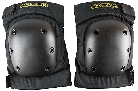 A pair of Harsh Pro Park Knee Skate Protection Pads in black features impact-resistant hard plastic shells and adjustable straps, with the brand name "Harsh" highlighted in yellow at the top. The durable design includes multiple rivets on each pad for added strength.
