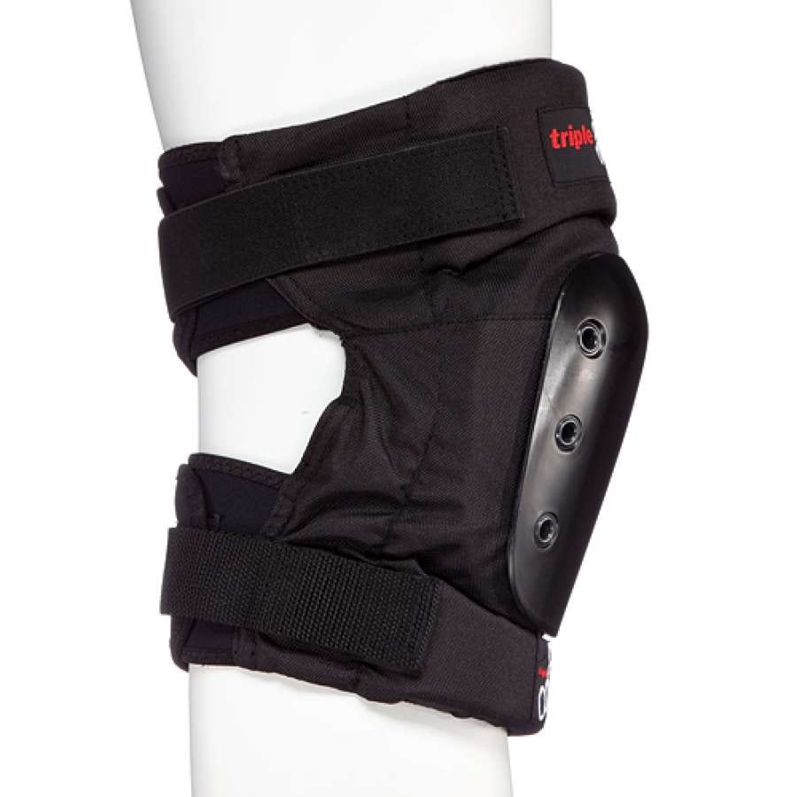 The Triple 8 KP 22 Knee Skate Protection Pads in black are crafted with EVA memory foam and adjustable straps, equipped with a hard protective shell on the side to provide skaters with exceptional impact protection. Displayed on a white mannequin leg, these pads from Triple 8 elegantly blend style and functionality for any skating enthusiast.